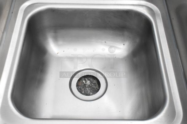 Brand new Kratos 28W-091 stainless steel single bay wall mount sink, scratch and dent condition, visible scuffs inside.