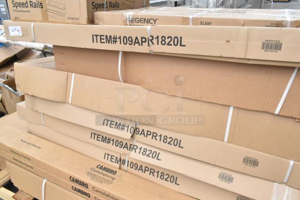 Boxes of new scratch and dent items for auction, including Steelton speed rails, Regency pan racks, and Cambro shelving kits.