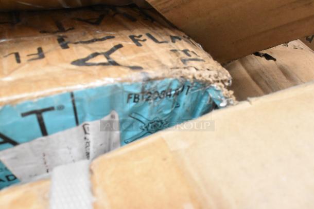 Damaged cardboard box with blue packing label and visible markings, containing Regency stainless steel items. Corners are worn.