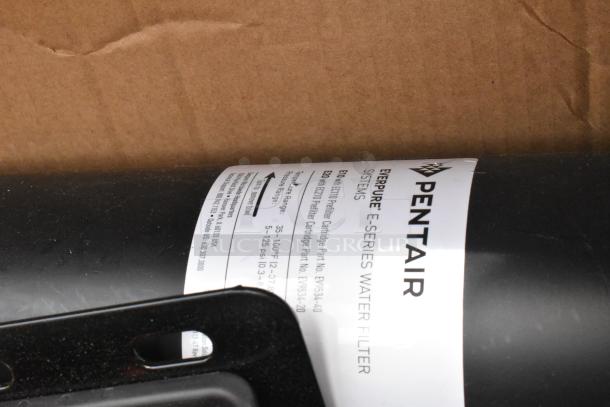 Pentair Everpure E-Series water filter with label showing model EX735-40. Black casing, new condition.