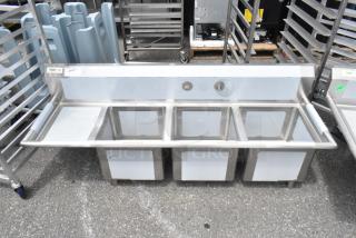 Regency 600S3151515L stainless steel 3 bay sink with left side drain board. Brand new, scratch and dent condition.