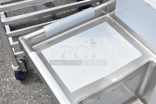 Brand new Regency 600S3151515L stainless steel 3 bay sink with left side drain board, minor scratches visible.