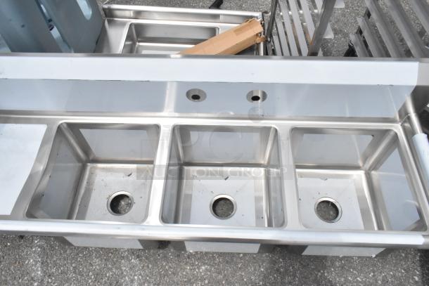Regency 600S3151515L stainless steel 3-bay sink with a left side drain board, brand new with minor scratches.