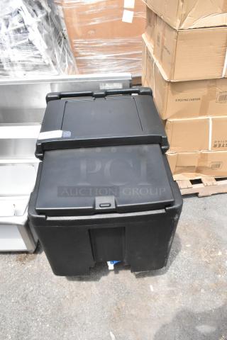 Black Cambro poly insulated portable ice bin, brand new with scratches, on commercial casters.