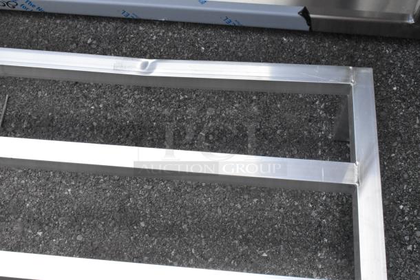 BRAND NEW SCRATCH AND DENT Regency 600DUN24488 Aluminum Dunnage Rack, 48"x24"x8", 1780 lb. capacity, visible dent on surface.