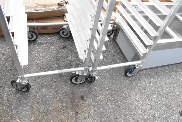 2 Brand New Scratch and Dent Regency 600STPR20KD 20 Pan Aluminum Steam Table Pan Rack on Commercial Casters.