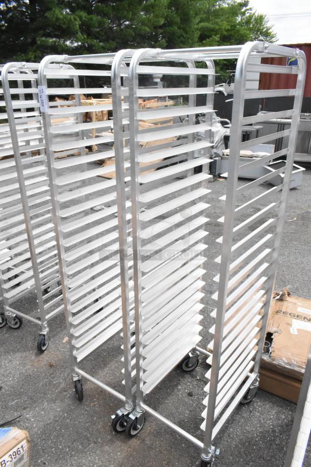2 new Regency 600STPR20KD aluminum steam table pan racks, 20 pan capacity, on commercial casters, minor scratch and dent.