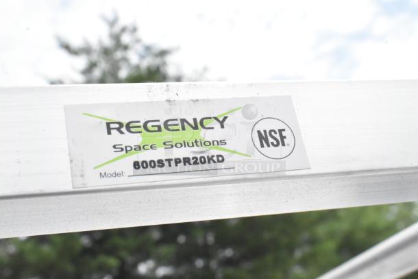 Alt text: Regency 600STPR20KD aluminum steam table pan rack label, NSF certified, on scratch and dent condition commercial casters.