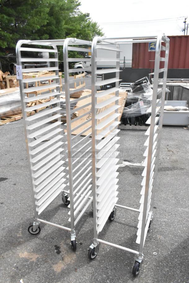 2 brand new Regency 600STPR20KD aluminum steam table pan racks with 20 slots on commercial casters, slightly scratched.