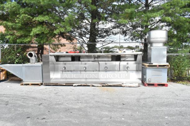 Stainless steel commercial grease hood with mushroom exhaust fan and FloAire SA15 make-up air vent system.
