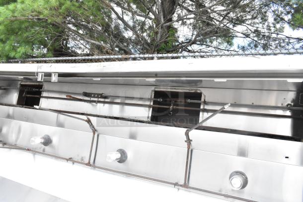 Stainless steel commercial grease hood with mushroom exhaust fan and FloAire SA15 filter. Appears in good condition.