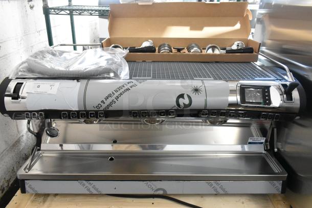 Brand new Nuova Simonelli 238AUWV3 Aurelia Wave 3 Group Espresso Machine, stainless steel, with 4 portafilters, 2 steam wands.