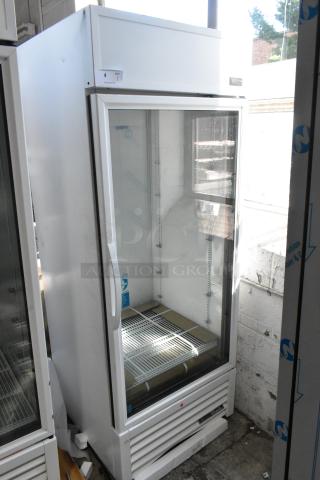 BRAND NEW 2021 True TSCI-600R-G-PH commercial cooler. Single door, poly racks, minor dents visible, 115V 1-phase.