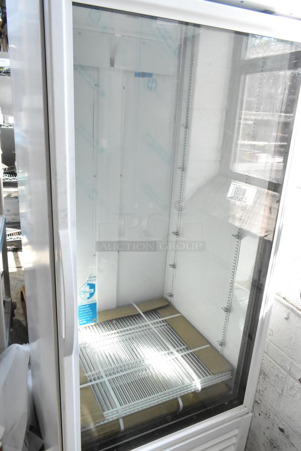 Brand new 2021 True TSCI-600R-G-PH reach-in cooler merchandiser, single door, poly coated racks, 115V, minor scratches.