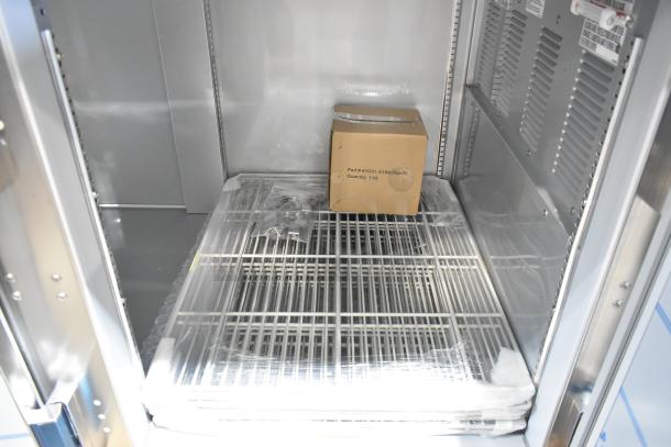 Beverage Air DP93HC stainless steel pizza prep table interior, new, scratch and dent condition, with shelves and packaging box.