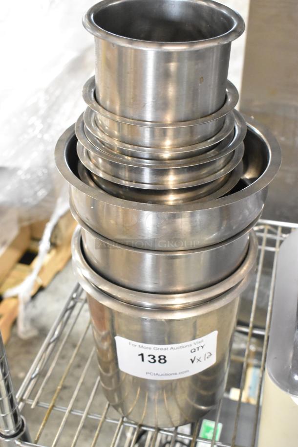 12 new stainless steel drop-in bins, cylindrical, scratch and dent condition. Includes food processor parts. Quantity 12.