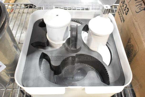 12 brand new scratch and dent items, including stainless steel cylindrical drop-in bins and food processor parts, unopened.