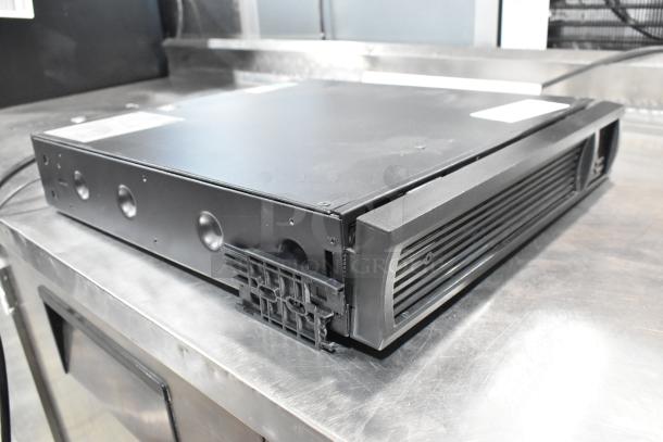 Dual APC Uninterruptible Power Supplies, black, in good condition. Front panel design with visible ventilation grilles.