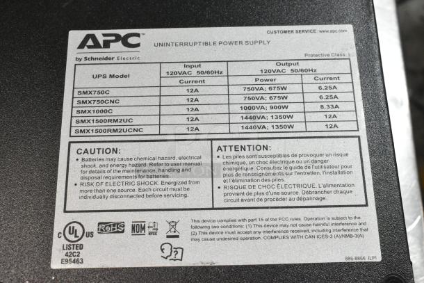APC Uninterruptible Power Supply label showing models, input/output details, and safety warnings by Schneider Electric.