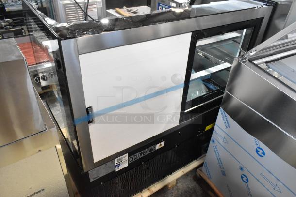 Avantco 193BC48HCB 48" black refrigerated bakery display case, curved glass, one section broken, new condition, 120V, 1 phase.