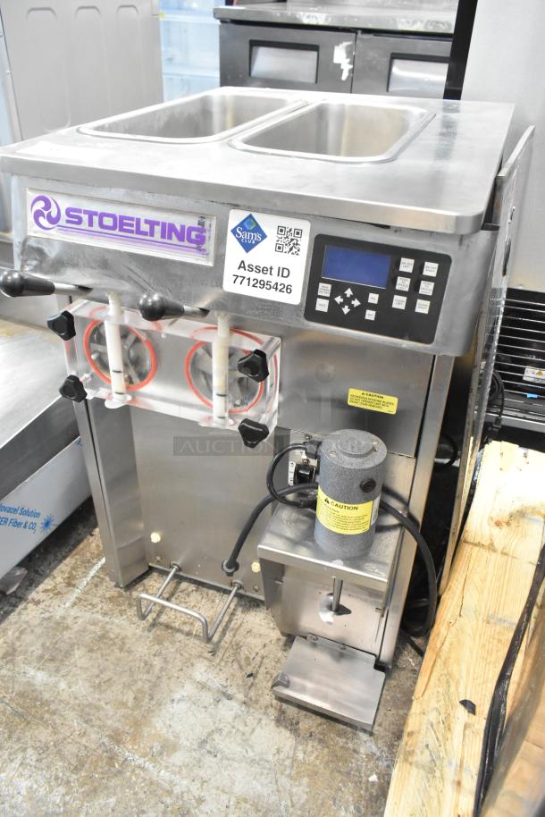 Stoelting SF121-38I2 stainless steel soft serve ice cream machine, 2 flavors with twist. Features digital control panel, asset ID visible.