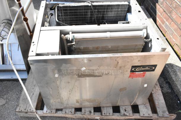 Cornelius CCM0530AH1 metal commercial ice head on pallet. 115 volts, 1 phase. Visible wear, Cornelius label on front.