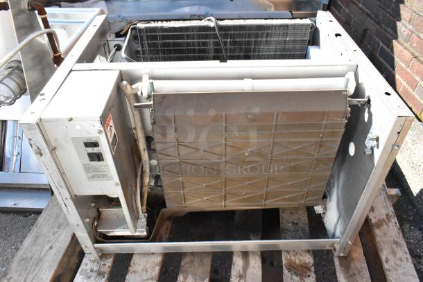 Cornelius CCM0530AH1 metal commercial ice head, 115 volts, 1 phase, used condition, open view showing components, markings visible.