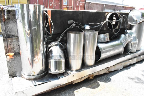 Stainless steel commercial grease hood with mushroom exhaust fan, FloAire SA15 filter, and make-up air vent in good condition.