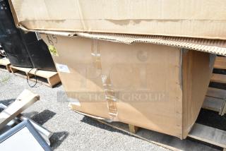 Brand new SKSPK480FM in original packaging with visible box damage, noted as "scratch and dent," on a pallet.