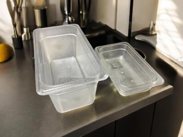 Cambro clear food storage containers, 1/3 and 1/4 size, in excellent condition, shown on a kitchen counter.