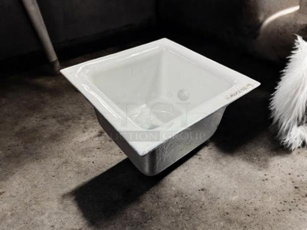 PROFLO 12" x 12" enameled cast iron floor sink with aluminum strainer, model pf906k, in excellent condition.