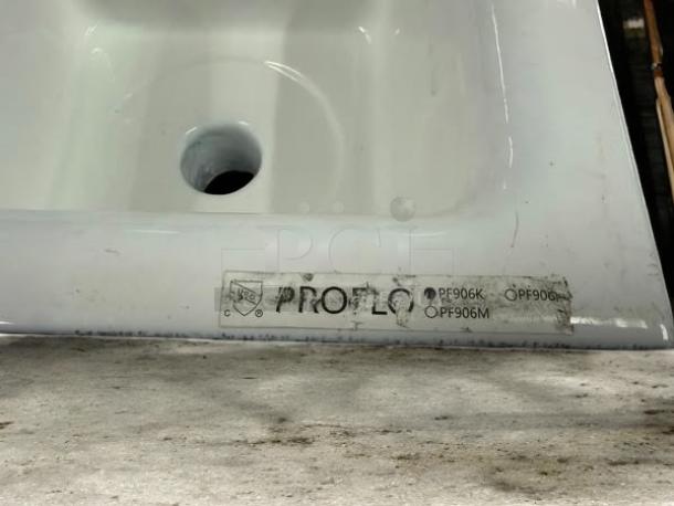 PROFLO 12" x 12" enameled cast iron floor sink with aluminum strainer, model PF906K. Excellent condition.