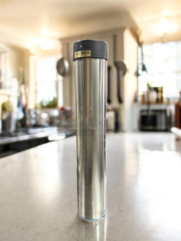 San Jamar C3400P stainless steel cup dispenser, 12-24 oz capacity, wall mount, excellent condition, pull-type design.