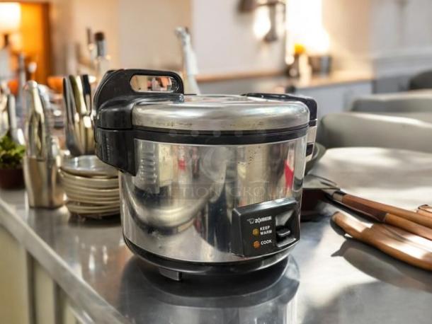 Zojirushi NYC-36 20 cup electric rice cooker, stainless steel, 120v, excellent condition, tested and working, on a kitchen counter.
