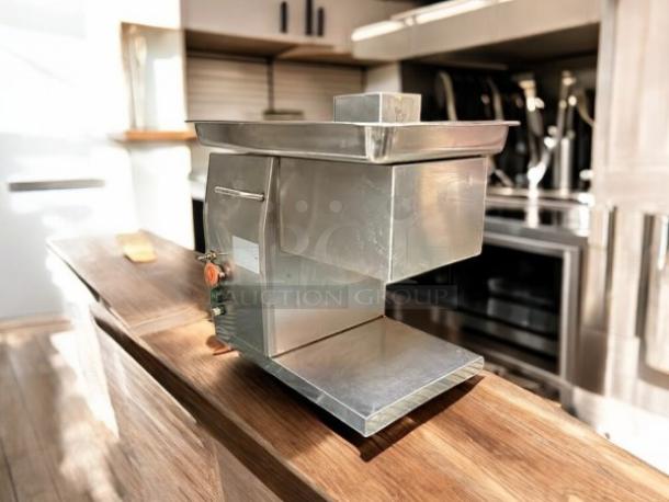Countertop 115v meat grinder, 12"W x 16"D x 15"H, stainless steel, fully tested, great condition, sleek design.