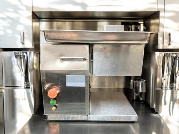 Countertop 115v meat grinder, 12” W x 16” D x 15” H, stainless steel, great condition, tested and working, control panel visible.