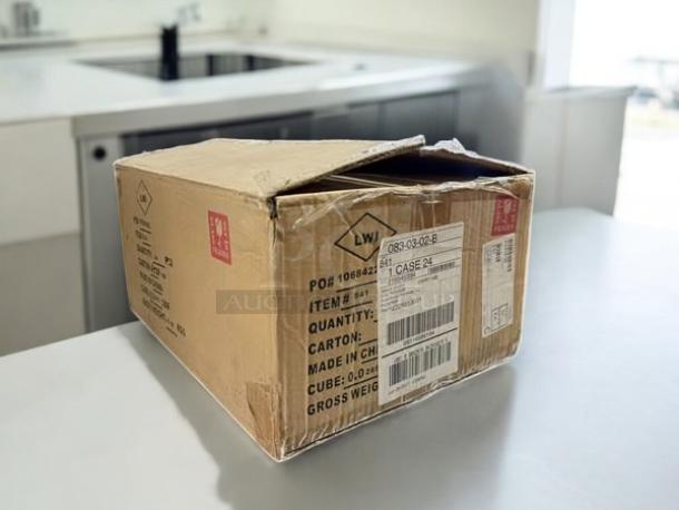 The image shows a closed cardboard box labeled with product details, containing stemless goblet-style clear votive candle holders in great condition.