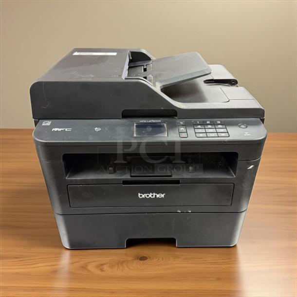 Brother MFC-L2750DW All-in-One Laser Printer in excellent condition, fully tested, with control panel and logo visible.