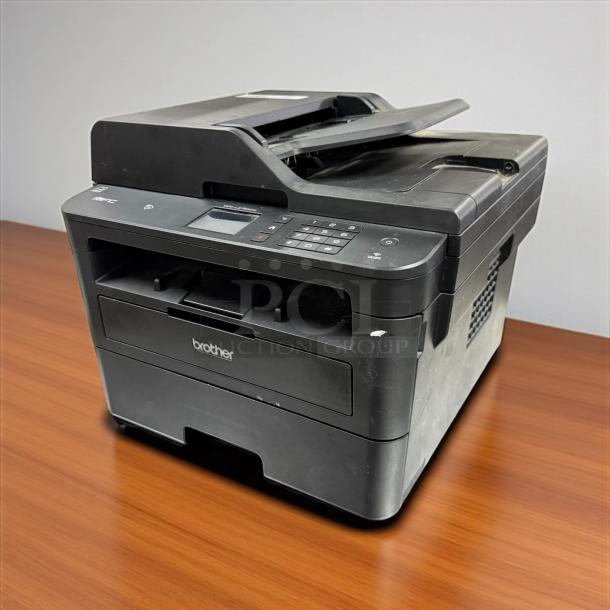 Brother MFC-L2750DW all-in-one laser printer in awesome condition, fully tested and working. Features a control panel and compact design.