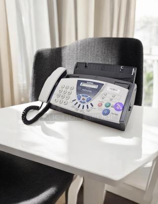 Brother FAX-575 fax machine, phone, and copier on a table. Tested and working, in amazing condition with clear buttons and labels.