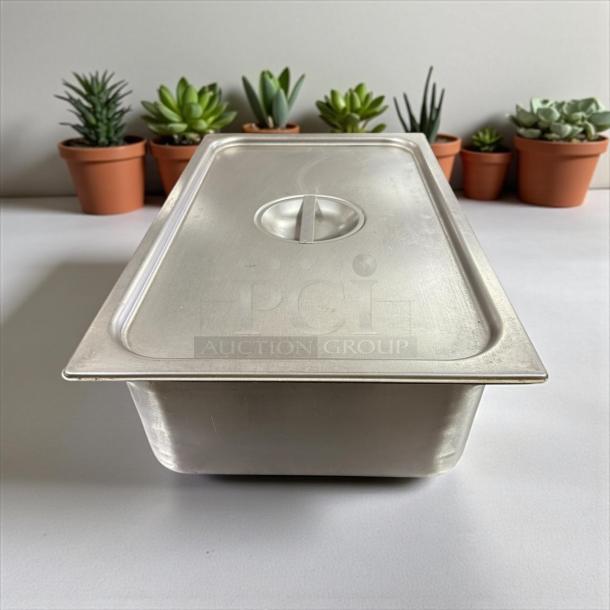 Full-size 6" deep stainless steel hotel pan with lid in excellent condition, ideal for catering or buffet use.