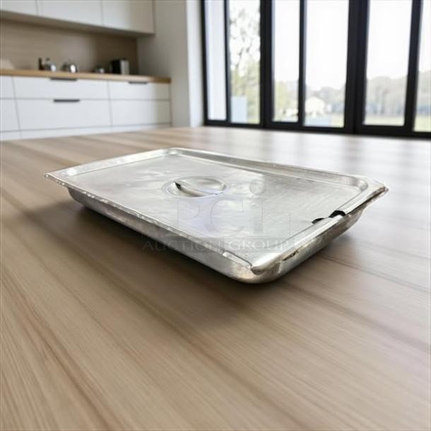 Full-size 2" deep stainless steel hotel pan with lid, great condition, shown on a wooden surface.