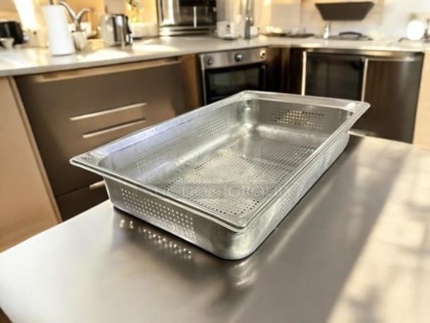 Full-size 4" deep stainless steel hotel pan strainer with lid, excellent condition. Perforated design, durable.