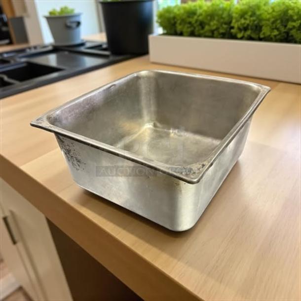 Stainless steel hotel pan, 1/2 size, 6in deep, great condition, minor wear, ideal for commercial kitchen use.