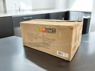 Box containing Zuni Mod Jump Table Lamp. Item number 53001. Color: Rust & Amber. Weight: 5.44 kg. Made in China.