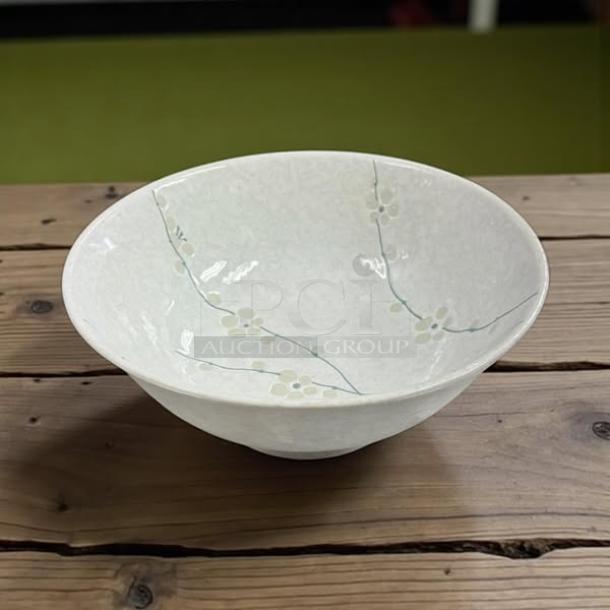 8.5" white ceramic bowl, made in Japan, features delicate floral design. Excellent condition, collectible.