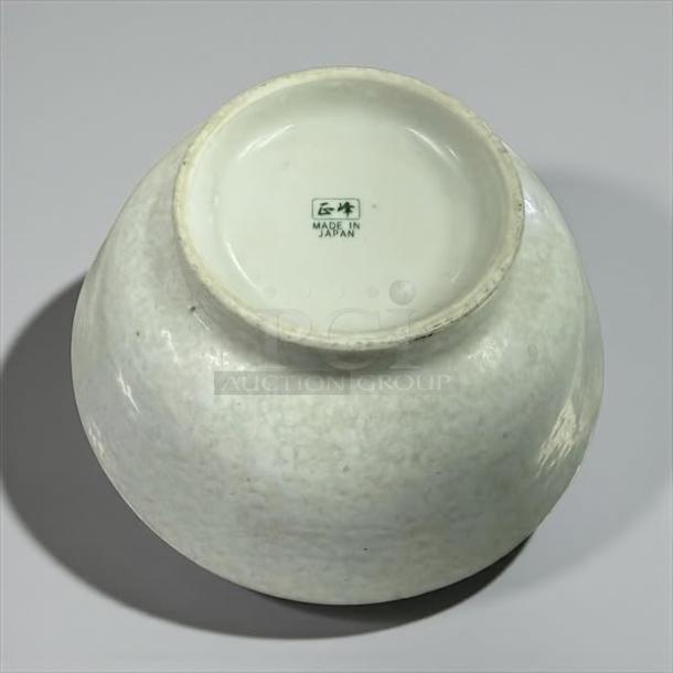 8 1/2" white ceramic bowl, made in Japan, excellent condition, bottom marked with design symbol and "MADE IN JAPAN".