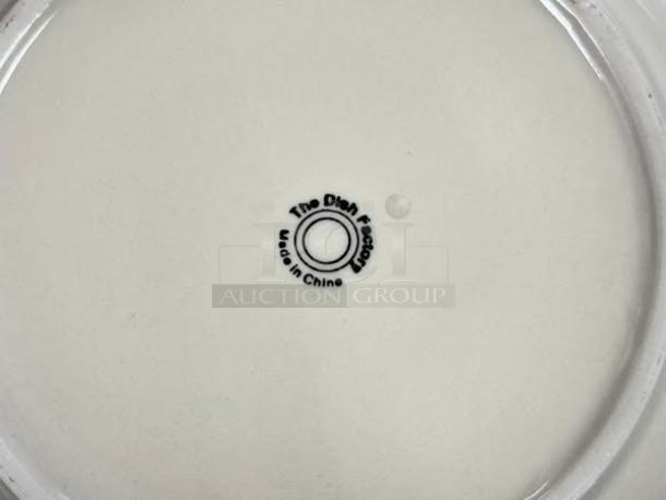 The Dish Factory 12" eggshell dining plate, excellent condition, marked "Made in China" with logo on base.