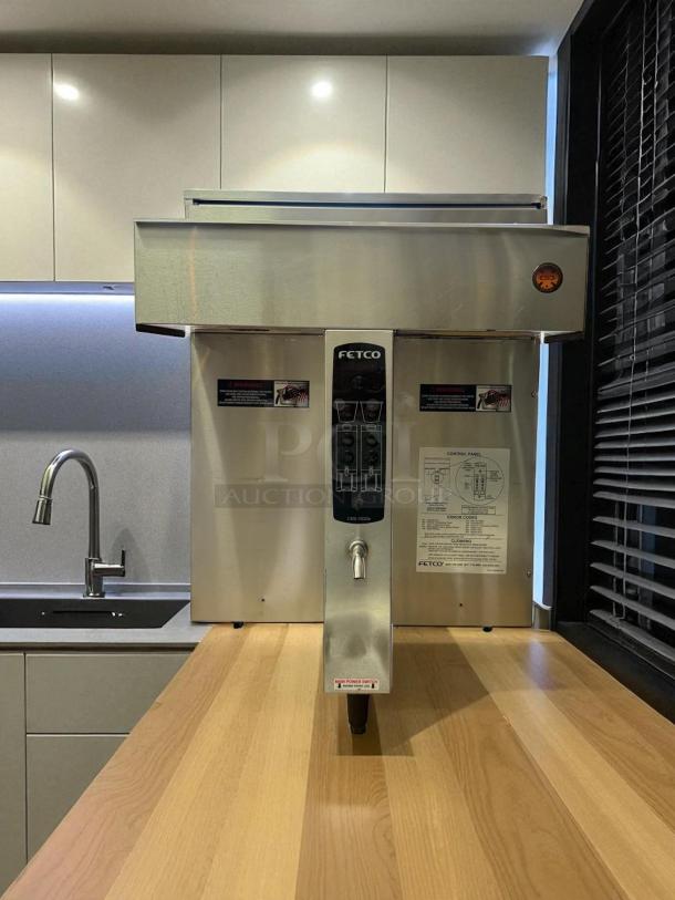 Fetco CBS-2032E twin dual coffee brewer, stainless steel, excellent condition, fully tested, visible label with instructions.