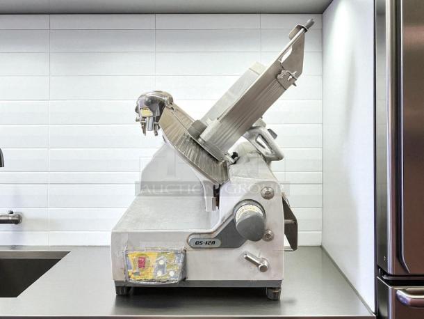 German Knife GS-12A food slicer, heavy-duty, tested and working, 115v. Features durable construction and precision slicing.